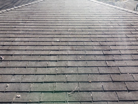 image of roof with lifting shingles