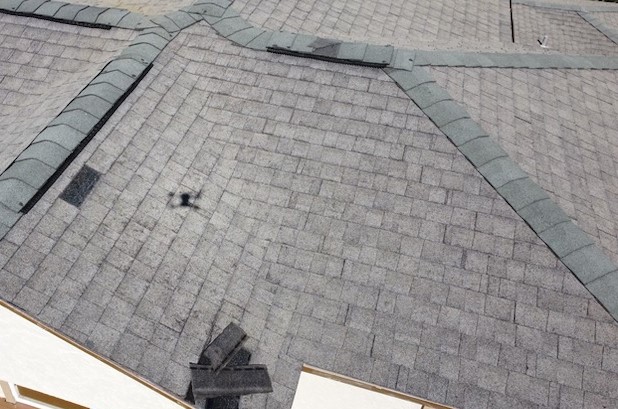 image of roof with a section of missing shingles