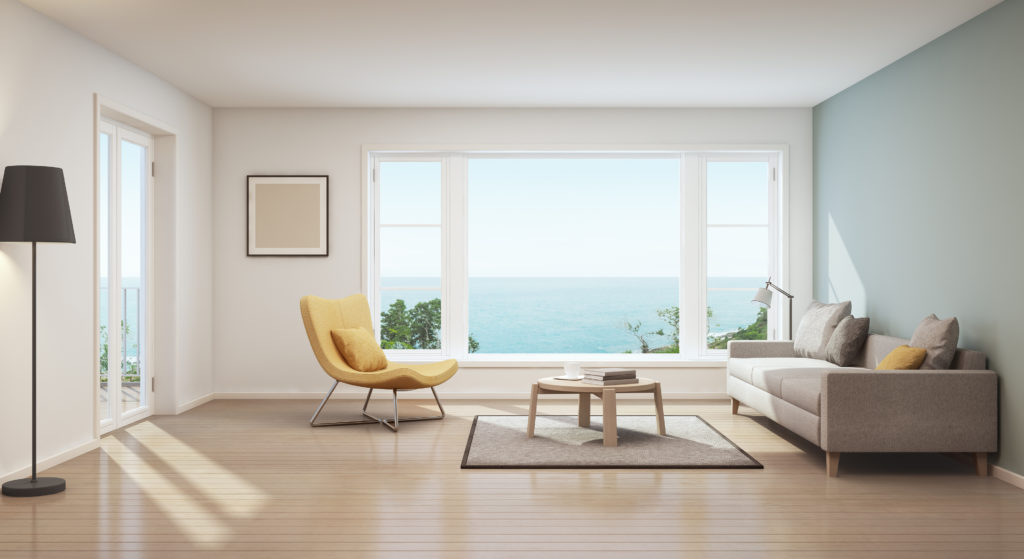 image of living room with view of the sea out of centered window
